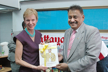 Pattaya Mai MD Peter Malhotra (right) presents a copy our book about HM the King’s birthday to HE Kristie Kenney, U.S. Ambassador to Thailand. 