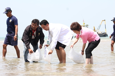 Mayor Itthiphol Kunplome and city officials symbolically release fish and shrimp to generate interest in the project to restore the area’s natural resources. 