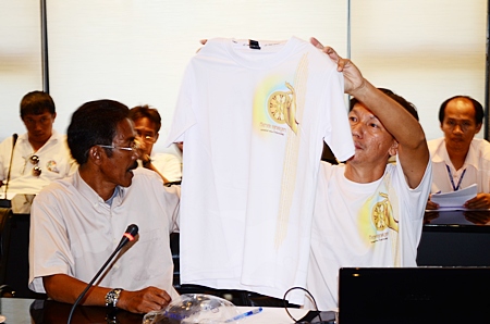 Waree Inthana (left) and Kittinan Chakart (right) display the shirts that applicants will receive on the day of the run. 