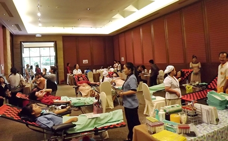 Employees at the Sheraton Pattaya Resort and friends roll up their sleeves to donate blood. 