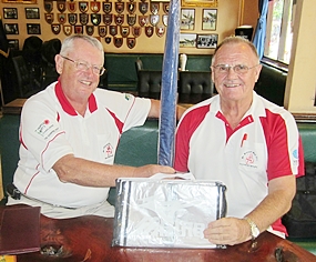 Dick Warberg, left, presents the MBMG ‘golfer of the month’ award to Derek Brook.  