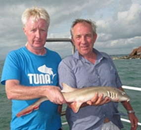 Peter Holt and Dave Chilton pose with their shared catch.