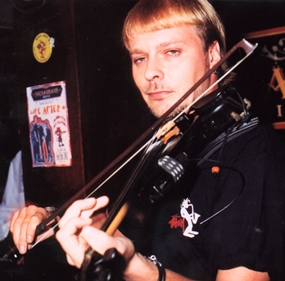 A portrait with the face in focus and the hand out of focus. 