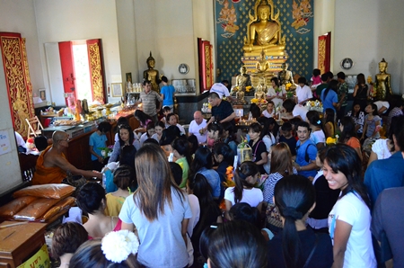Buddhists gather at Wat Chaiyamongkol in South Pattaya to present Sangkhathan (necessary items for monks) and make merit on Visakha Bucha Day.