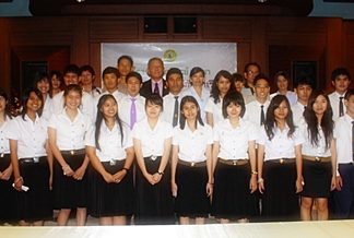 Former students of Maryvit Pattaya who have passed university level examinations pose for a group picture with school officials and teachers.
