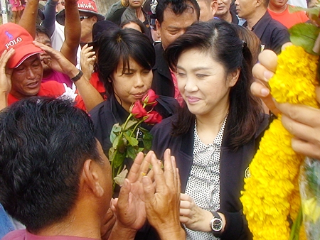 Prime Minister Yingluck Shinawatra is greeted by adoring followers as she arrives for the Kingdom’s 5th Mobile Cabinet Meeting held here in Pattaya June 18-19.