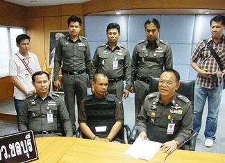 Police have arrested Thanuu “Nu Makhamkhu” Klanthut (seated, center), the last remaining suspect in the 2008 killing of a car care executive.
