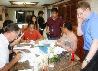 Investigators pour through documents seized at Hannu Tapani Torpström Pattaya home.