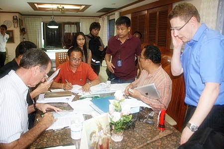 Investigators pour through documents seized at Hannu Tapani Torpström Pattaya home. 