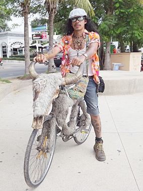 Sunya Sompu turns heads when riding around town on his water buffalo bike.