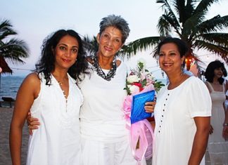 Anou McPherson (left) and Rachna Rao (right) say happy birthday to Pat Burbridge.
