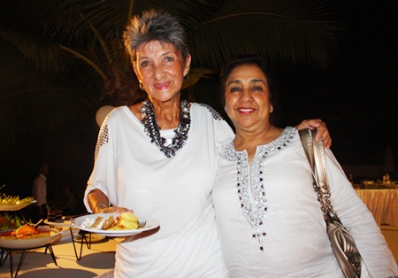Pat Burbridge and Rani Khanijou enjoy some birthday cake.