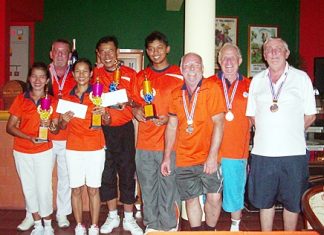 The winners, far left, pose with the runners-up and losing semi-finalists at the Coco Club, Sunday, June 17.