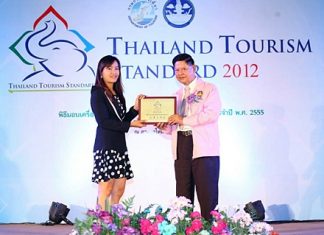 Deputy Prime Minister Chumpol Silpa-archa presents the award to Royal Cliff Hotels Group’s assistant to PR manager, Phusanisa Janyouk