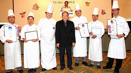 GM Chatchawal Supachayanont (centre) and Executive Chef Adrian W. O’Herlihy (3rd left) stand proudly with the Kitchen Team of Dusit Thani Pattaya who received certificates of commendation at the Thailand Ultimate Chefs Challenge 2012 held in Bangkok recently. The event was held to promote and recognize the skills and talents of professional chefs in Thailand. (L to R) Srithon Pongham, Chef de Partie (Patisserie); Khanatsanan Wangsa, Commis II (Patisserie); Chef Adrian, Chatchawal Supachayanont; Somchai Kumpoo, Demi-Chef de Partie (Gardemanger) and Narong Chawicha (Chef Pâtissier). The kitchen talents took home the silver and bronze awards from the Fruit Carving and Ice Carving categories as well as Western Plated Desserts and Freestyle Showpiece challenges.