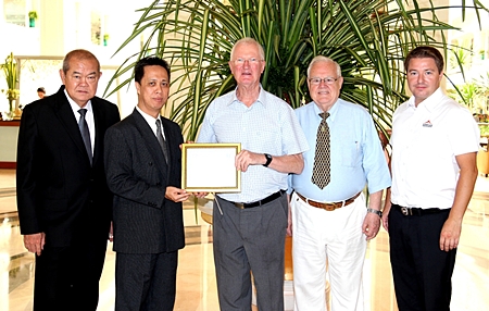 Representatives of the Rotary Club of Jomtien-Pattaya, headed by Philip Wall Morris, Service Projects Chairman, Brendan Kelly and Ronny Heltne presented a Plaque of Appreciation to Neoh Kean Boon, resident manager and Waran Chalermrithichai, Director of Administration of the Dusit Thani Pattaya in gratitude for the hotel’s kind sponsorship and generous support of the 2011 Rotary Charity Cross Bay Swim recently. Funds raised from this event helped to provide clean drinking water to thousands of children and residents of the outlying communities in Thailand.