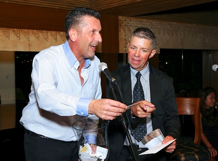 Cees Cuijpers picks a lucky winner of a cruise around Bangkok donated by the Anantara Riverside.
