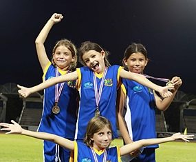Year 4 girls Gold medal relay team (from left) Inez, Tessa, Jessica, and Golate (front).