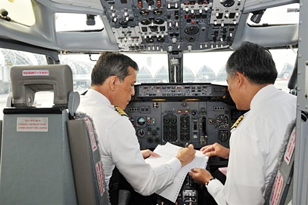 His Royal Highness Crown Prince Maha Vajiralongkorn goes through pre-flight preparations before takeoff on a special Buddhist Pilgrimage Flight he piloted to India.