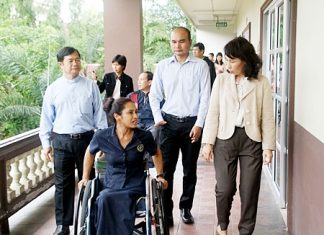 Dr. Picharn Jaiseri (left), president of the Redemptorist Center for Persons with Disabilities, leads Napa Setthakorn (right) and her the NEP committee on a tour of the foundation.