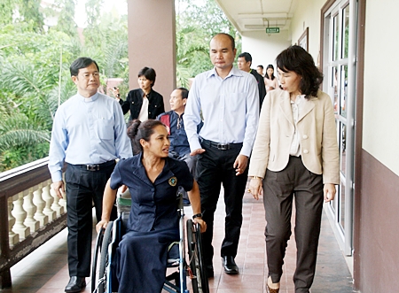 Dr. Picharn Jaiseri (left), president of the Redemptorist Center for Persons with Disabilities, leads Napa Setthakorn (right) and her the NEP committee on a tour of the foundation. 