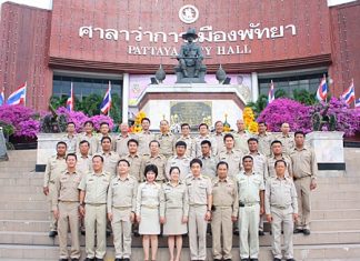 Pattaya’s newly re-elected mayor, deputy mayors and city council members in front of the King Taksin Monument at City Hall.