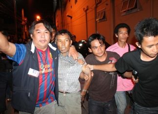 Police corral the drunken man.