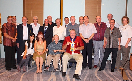 Members of the Rotary Club Taksin-Pattaya pose for one final group photo before merging with the Rotary Club of the Eastern Seaboard. 