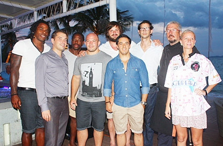 Rugby players pose for a souvenir photo with Pullman executives and friends.