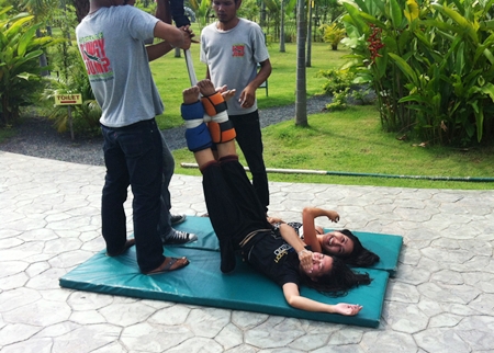 Team members prepare to ride the dreaded bungee jump. 