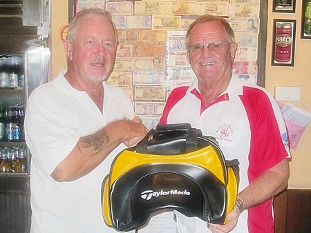 Barry Elphick, left, receives the MBMG golfer of the month prize from Derek Brook.
