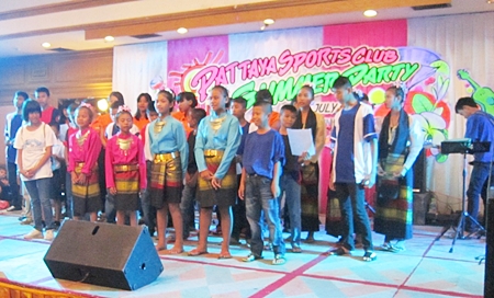 Children from the Baan Jing Jai orphanage take to the stage.