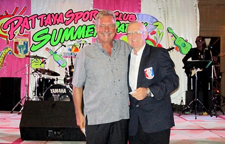 Lucky draw prize winner Ken Bernek, left, stands with PSC President Tony Oakes, right.