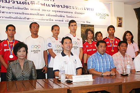 Pattaya Mayor Ittipol Kunplome, President of Thailand Windsurf Association, and Sonthaya Khunplome, President of Chonburi Sports Association, seated center, chair the welcoming committee for the successful Thai windsurfers, standing rear. 
