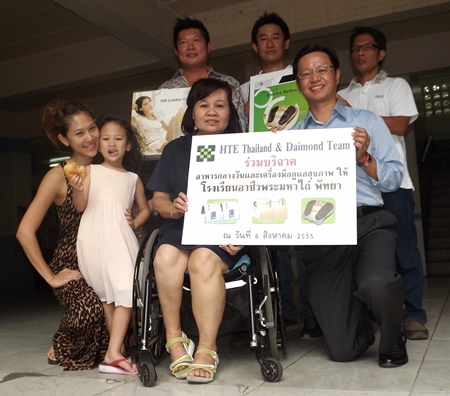 Simon Yeh (right), COO of Asia HTE International Group together with Shinthien Enterprise Co. Ltd, accompanied by his team donated healthcare products and equipment to help improve mobility of the disabled at the Pattaya Redemptorist Vocational School recently. They were welcomed by Khummun Sreesa-ad (centre in wheelchair), head of finance at the school. Simon Yeh (right), COO of Asia HTE International Group together with Shinthien Enterprise Co. Ltd, accompanied by his team donated healthcare products and equipment to help improve mobility of the disabled at the Pattaya Redemptorist Vocational School recently. They were welcomed by Khummun Sreesa-ad (centre in wheelchair), head of finance at the school.