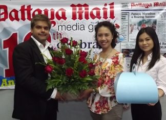 Tony Malhotra, Asst. MD of the Pattaya Mail Media Group receives a bouquet from Usa Pookpant, PR manager and Wirasinee Kaewkeeree, PR executive of Centara Grand Mirage Beach Resort Pattaya to congratulate us on our recent 19th anniversary.