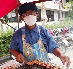 Almost ruined by last year’s devastating floods, Sorn Pongkhan found a lifeline selling pork on a stick.
