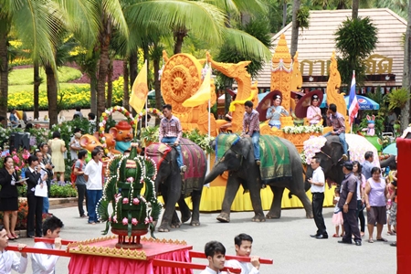 Elephants and a giant candle are centerpieces at the Nong Nooch Tropical Gardens parade.