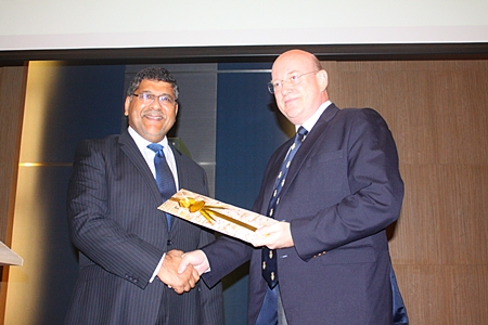 Former BCCT Chairman Graham Macdonald (right) presents a gift to the departing British Ambassador to Thailand HE Asif Ahmad.