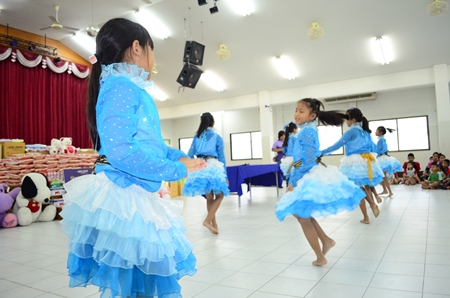 Young girls perform a beautiful dance.