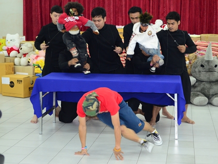 The puppet troupe does a break dance for the party.