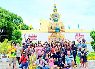 Students from Buriram Rajabhat University pose for a group picture during their field trip to Mini Siam.