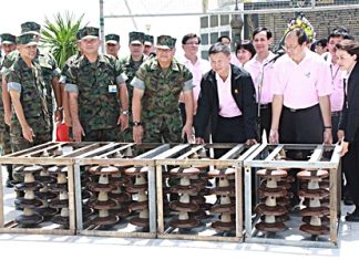EGAT officials and top Navy brass announce the handover of electrical parts designated to be used to form an artificial coral reefs.