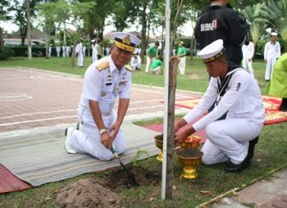 Rear Adm. Thawee Phikulthong plants a tree dedicated to HM the Queen.