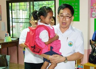 Dr. Pornthep Siriwanarangsun, director-general of Thailand’s Disease Prevention and Control Department, visits the Khao Maikaew children’s center to give administrators tips on preventing the spread of Hand, Foot and Mouth disease.