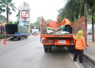 City workers clean up the usual mess left behind by still another big event on Beach Road.
