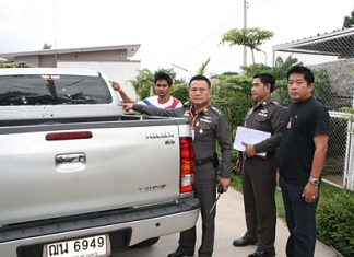 Wuthipan Krajuikrajai (left) shows Pol. Col. Somnuk Changate and other police officials damage done to his pickup from the late night barrage of gunfire.