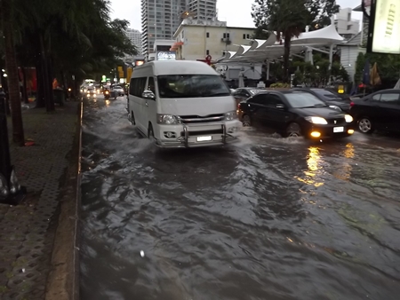 Hours after the rain had stopped, Beach Road was still flooded. 