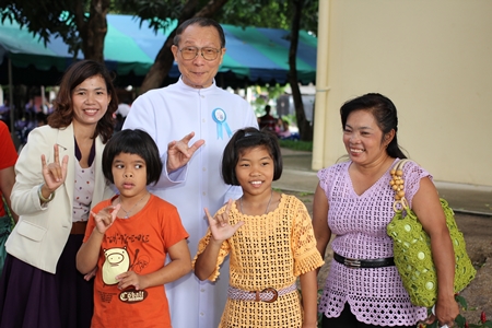 Father Veera Phangrak adds some warmth and humor to the anniversary proceedings.