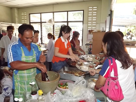 YWCA and Issan Association members are hard at work in the kitchen, stirring up a lunch for the Redemptorist Vocational School. 